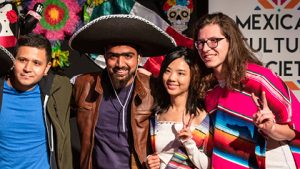 People pose in sombrero